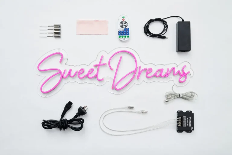 Woollahra Hotel Sydney Custom Pink LED Neon Heart Installation Pink LED neon sign reading Sweet Dreams on clear acrylic backing displayed in a flat lay with accessories