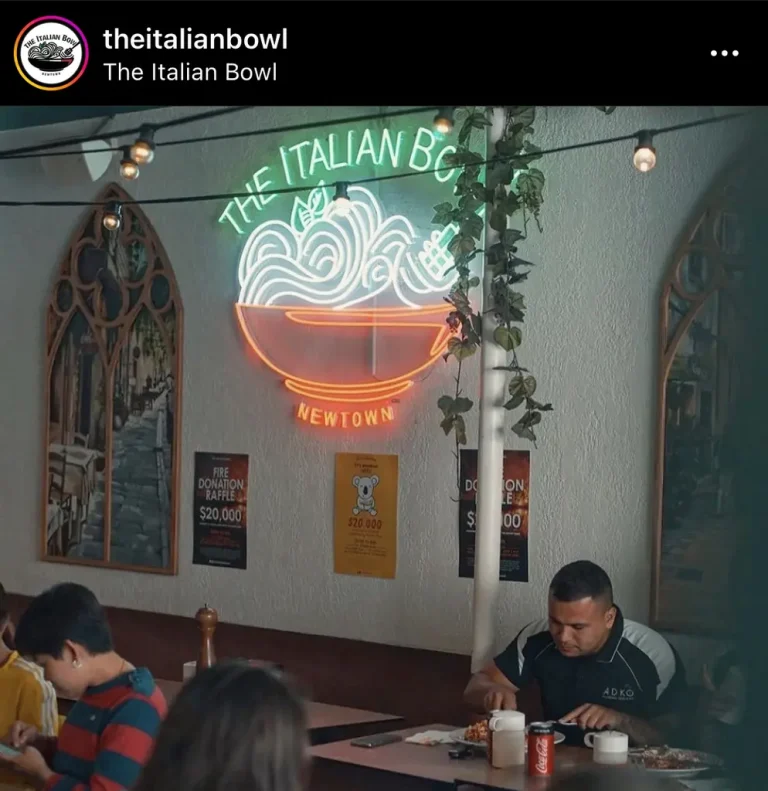 Custom LED neon sign featuring The Italian Bowl restaurant logo installed inside venue