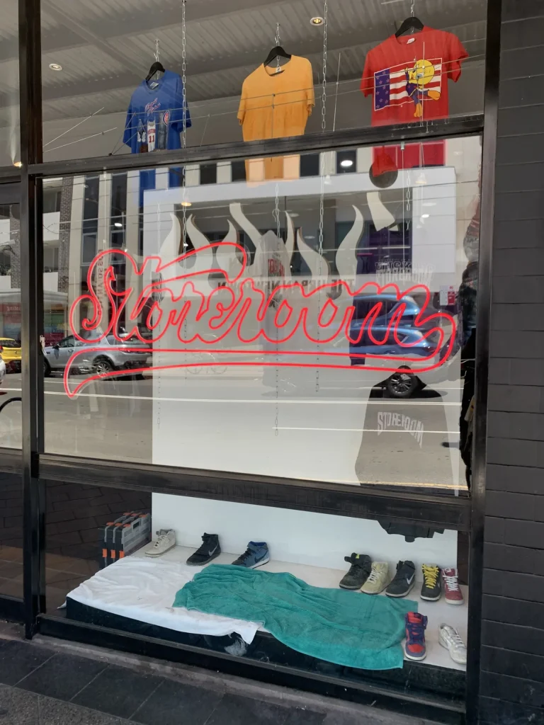 Red flame-style LED neon sign with Storerom text for Sydney storefront business signage Australia
