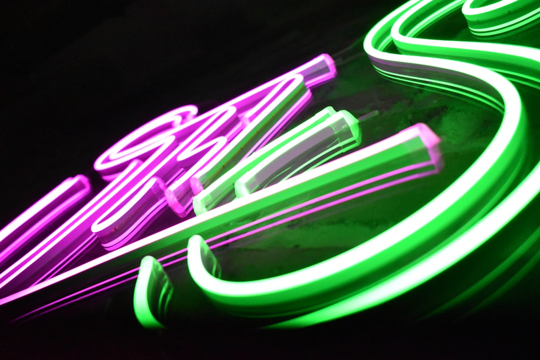 Close up of premium bespoke LED neon sign with precision engineered LED flex strips in pink green and white showcasing luxury finish by Beyond Neon Signs Sydney Australia