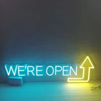We're Open Arrow LED neon sign glowing bright red and white, perfect for Australian businesses' signage