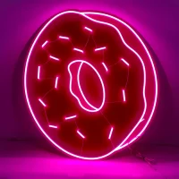 Donut LED neon sign glowing vibrant pink and white with a fun and playful vibe in Australia