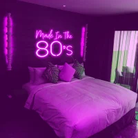 Made in the 80s LED neon sign glowing vibrant pink and blue colours in Australian style