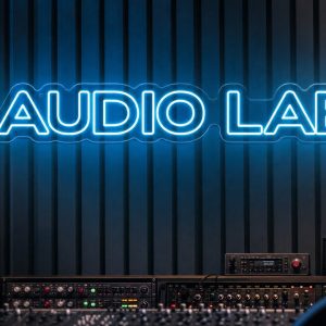 Audio Lab Neon Sign Audio Lab LED neon sign in ice blue in professional recording setup with acoustic wall panels