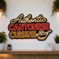 Authentic Cantonese Cuisine LED neon sign on clear acrylic backing mounted on white brick wall