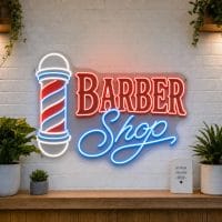 Barber Shop LED neon sign with classic barber pole icon on clear acrylic backing mounted on white brick wall