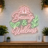Beauty and Wellness LED neon sign with lotus flower and spa stone icons on clear acrylic backing