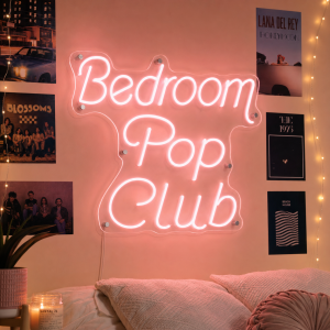 bedroom-pop-club-neon-sign Bedroom Pop Club neon sign glowing in a music studio