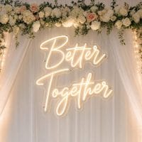 Custom Better Together LED neon sign for weddings and engagement parties. Contour-cut acrylic backin