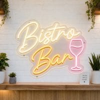 Bistro and Bar LED neon sign on clear acrylic backing mounted on white brick wall