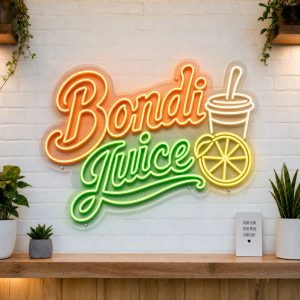 Bondi Juice LED neon sign on clear acrylic backing mounted on white brick wall