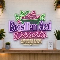 Brazilian Acai and Desserts LED neon sign on clear acrylic backing mounted on white brick wall