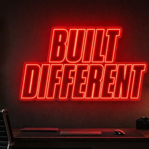 Built Different Neon Sign Built Different LED neon sign in red in industrial creator office with masculine high-performance aesthetic