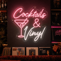 Cocktails and vinyl neon sign glowing on wall
