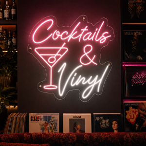 cocktails-and-vinyl-neon-sign Cocktails and vinyl neon sign glowing on wall