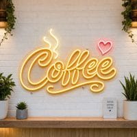 Coffee Script LED neon sign on clear acrylic backing mounted on white brick wall