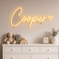 Cooper Name LED Neon Sign - warm golden yellow cursive script with heart on contour cut acrylic