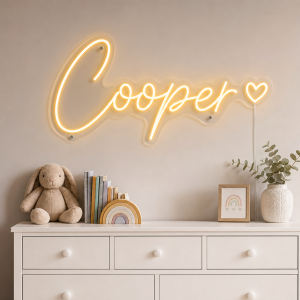 Cooper Name LED Neon Sign - warm golden yellow cursive script with heart on contour cut acrylic