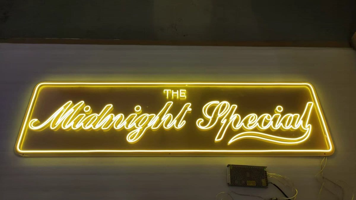 Yellow custom neon sign reading The Midnight Special in Australia