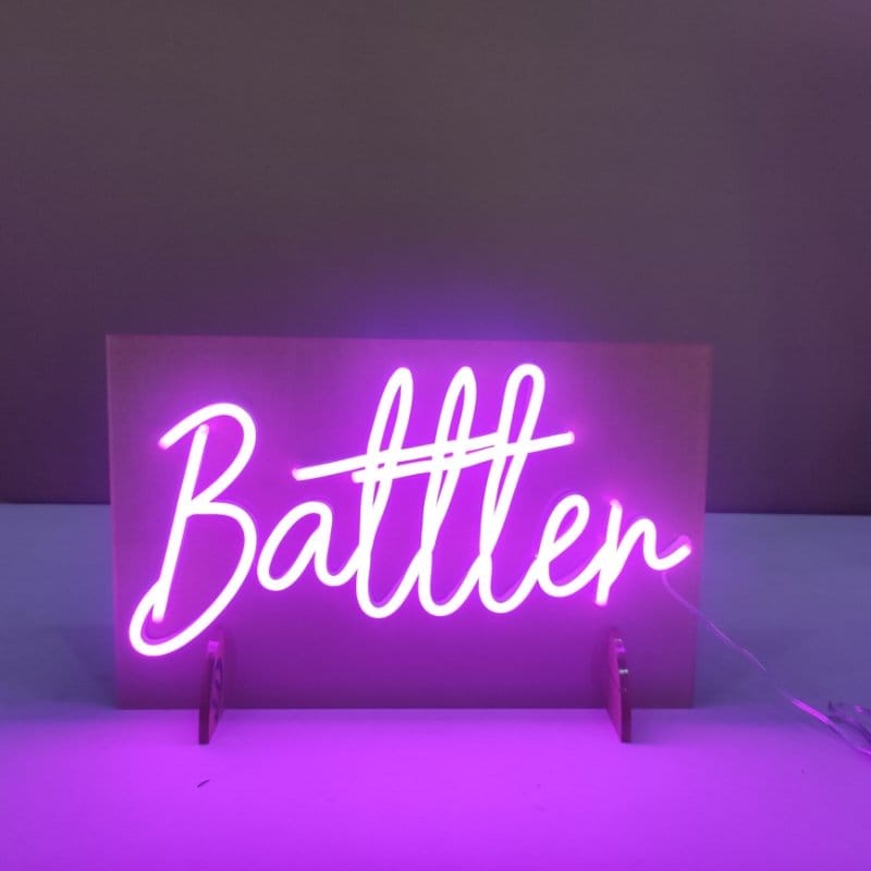 Custom purple neon sign displaying Battler on stand in Australia
