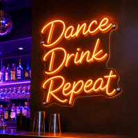 Dance Drink Repeat LED neon sign glowing on wall