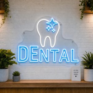 Dental LED neon sign with sparkling tooth icon on clear acrylic backing mounted on white brick wall