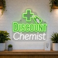 Discount Chemist LED neon sign with mortar and pestle and medical cross icons on clear acrylic backing