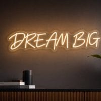 Dream Big LED neon sign in warm white script in luxury startup office with cinematic soft lighting