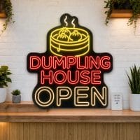 Dumpling House Open LED neon sign on clear acrylic backing mounted on white brick wall