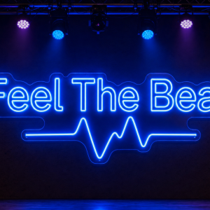 Feel The Beat LED neon sign in bold rounded font with minimal heartbeat pulse in blue on stage background