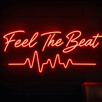 Feel The Beat LED neon sign in script font with simple heartbeat pulse line in red mounted on contour cut clear acrylic