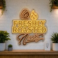 Freshly Roasted Nuts LED neon sign with roasting pan and nut icons on clear acrylic backing