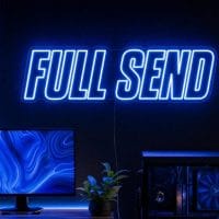 Full Send Neon Sign Full Send LED neon sign in electric blue in edgy streamer room with premium gaming aesthetic