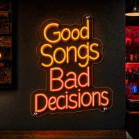 Good Songs Bad Decisions neon text sign glowing in a music venue