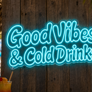 Good Vibes and Cold Drinks LED Neon Sign - vivid cyan retro bubble font on tropical beach bar wooden wall