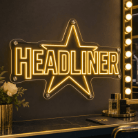 Headliner neon sign glowing in a music venue
