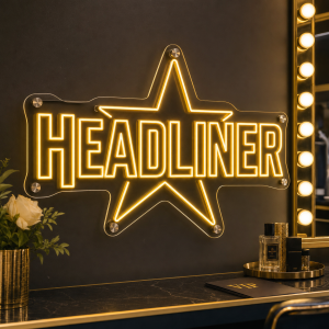 Headliner neon sign glowing in a music venue