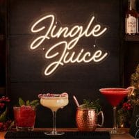 Custom Jingle Juice Christmas LED neon sign for festive bars and parties. Contour-cut acrylic backin