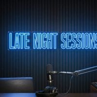 Late Night Sessions Neon Sign Late Night Sessions LED neon sign in blue in dark moody recording room with cinematic shadows