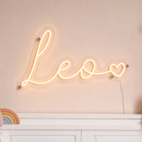 Leo Name LED Neon Sign - warm amber cursive script with heart on contour cut acrylic