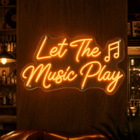 Let The Music Play Neon Sign glowing on wall