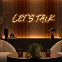 Lets Talk Neon Sign Lets Talk LED neon sign in warm white script in podcast interview setup with luxury lounge studio