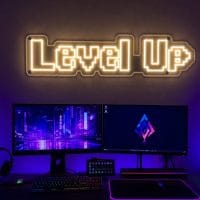 Custom Level Up Gaming LED neon sign for gaming rooms and esports setups. Contour-cut acrylic backin