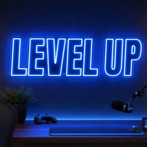 Level Up LED neon sign in electric blue in gaming creator setup with premium LED room