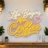 Life Begins After Coffee LED neon sign on clear acrylic backing mounted on white brick wall