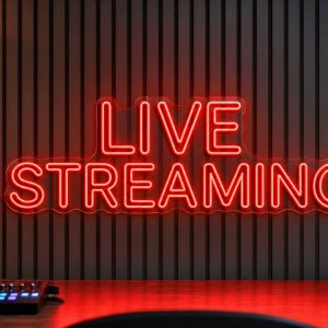 Live Streaming LED neon sign in red in streaming studio environment with realistic desk reflections