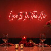 Custom Love Is in the Air LED neon sign for Valentine's Day and anniversaries. Contour-cut acrylic b