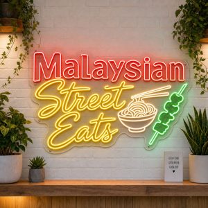 Malaysian Street Eats LED neon sign on clear acrylic backing mounted on white brick wall