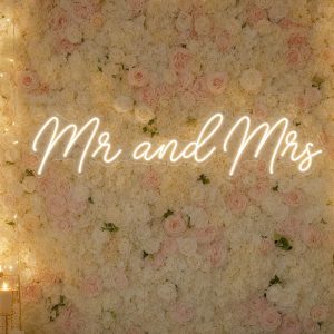 Custom Mr and Mrs LED neon sign for weddings and receptions. Contour-cut acrylic backing, silver scr
