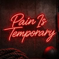 A red 'Pain Is Temporary' neon sign mounted on a dark, moody training space wall, with cinematic lighting and a realistic LED glow.